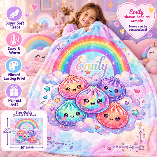 A child sits in a pastel bedroom holding a soft, colorful blanket featuring a rainbow, clouds, and cute pastel dumpling characters. The blanket has the name 'Emily' printed on it.