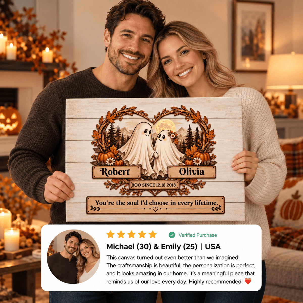 A couple holds up a personalized wooden canvas print in a cozy living room setting. The canvas features a rustic wood-grain design with two cartoon ghosts, autumn leaves, pumpkins, and custom names 'Robert' and 'Olivia' with '100th Birthday' text.