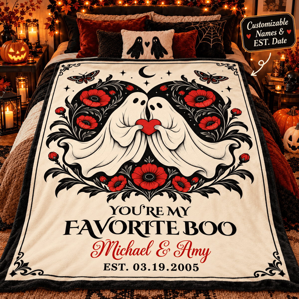 A personalized Halloween-themed blanket draped over a bed in a cozy, decorated bedroom. The blanket features a cream background with a black and white ghost design kissing, surrounded by red flowers and black leaves, with the text 'YOU'RE MY FAVORITE BOO Michael & Amy EST.