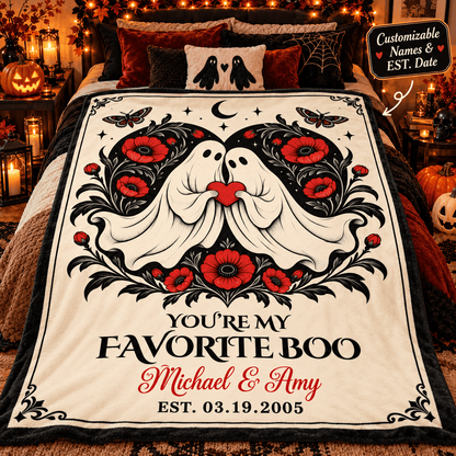 A personalized Halloween-themed blanket draped over a bed in a cozy, decorated bedroom. The blanket features a cream background with a black and white ghost design kissing, surrounded by red flowers and black leaves, with the text 'YOU'RE MY FAVORITE BOO Michael & Amy EST.