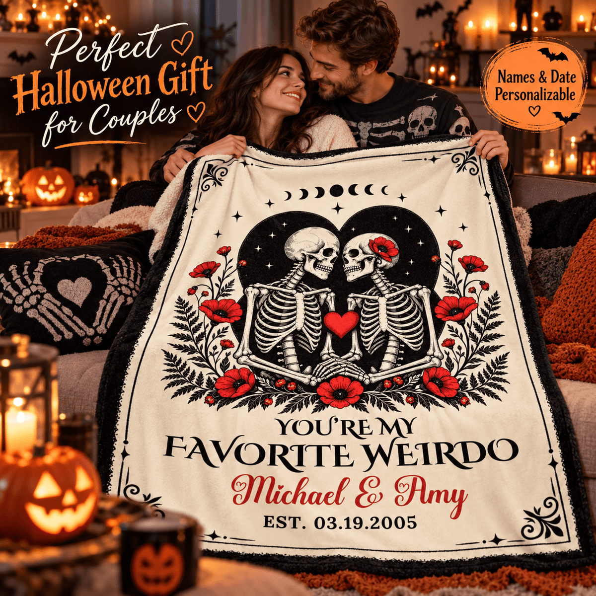 A couple hugging while holding up a personalized Halloween blanket in a cozy, warmly lit living room. The blanket features a black and white skeleton illustration with red poppies and text reading 'YOU'RE MY FAVORITE WEIRDO Michael & Amy EST.