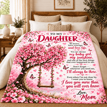 A pink printed bedding set featuring a large comforter with a cherry blossom swing, butterflies, hearts, and a sentimental poem addressed to a daughter, shown on a bed in a styled bedroom.
