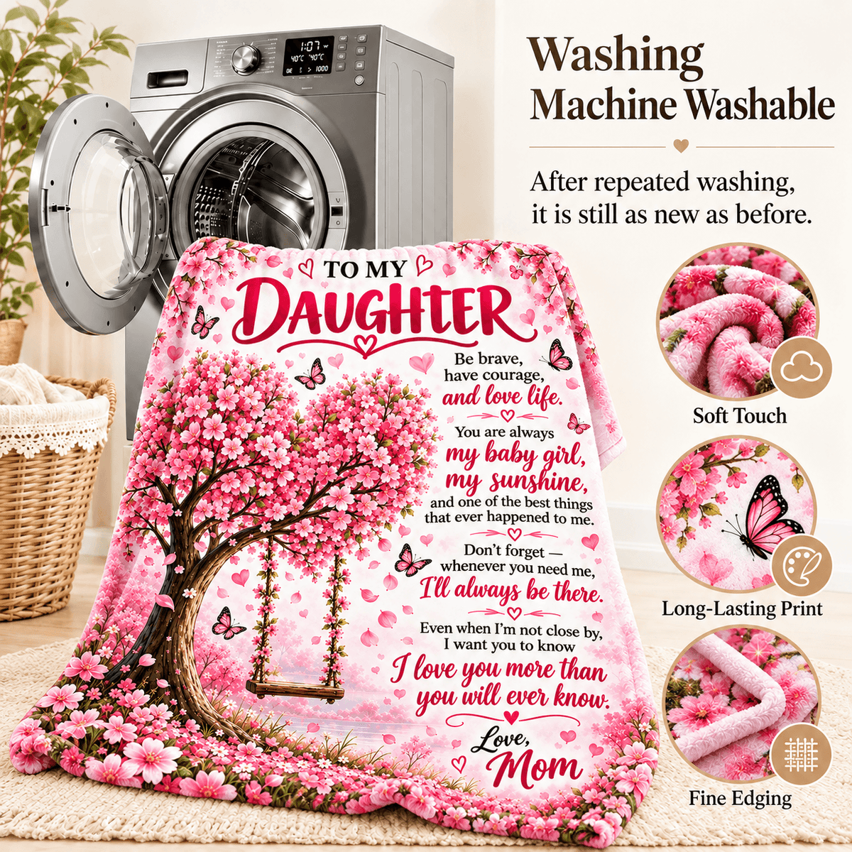 A pink floral blanket with a cherry blossom tree, butterflies, and a memorial-style message for a daughter is shown in front of a washing machine. Text on the image says it is washable, and circular callouts mention soft touch, long-lasting print, and fine edging.