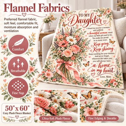 A cozy flannel blanket with a floral print and a sentimental poem for a daughter, displayed on a couch. The blanket features pink roses, green leaves, and a pink ribbon, with text overlays highlighting its comfort, breathability, and fine nap.