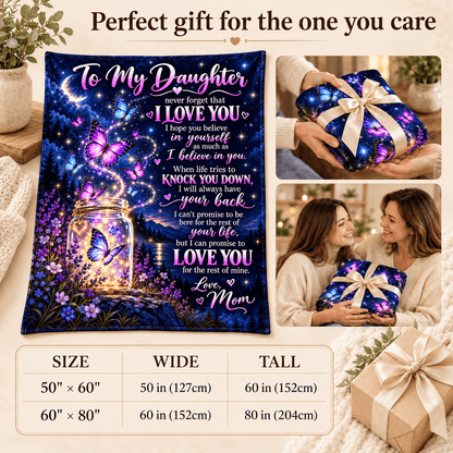 A decorative gift blanket featuring a colorful galaxy and butterfly design with a glowing mason jar and sentimental text for a daughter, shown on a styled beige background with inset photos of a woman holding the wrapped blanket and a size measurement table at the bottom.