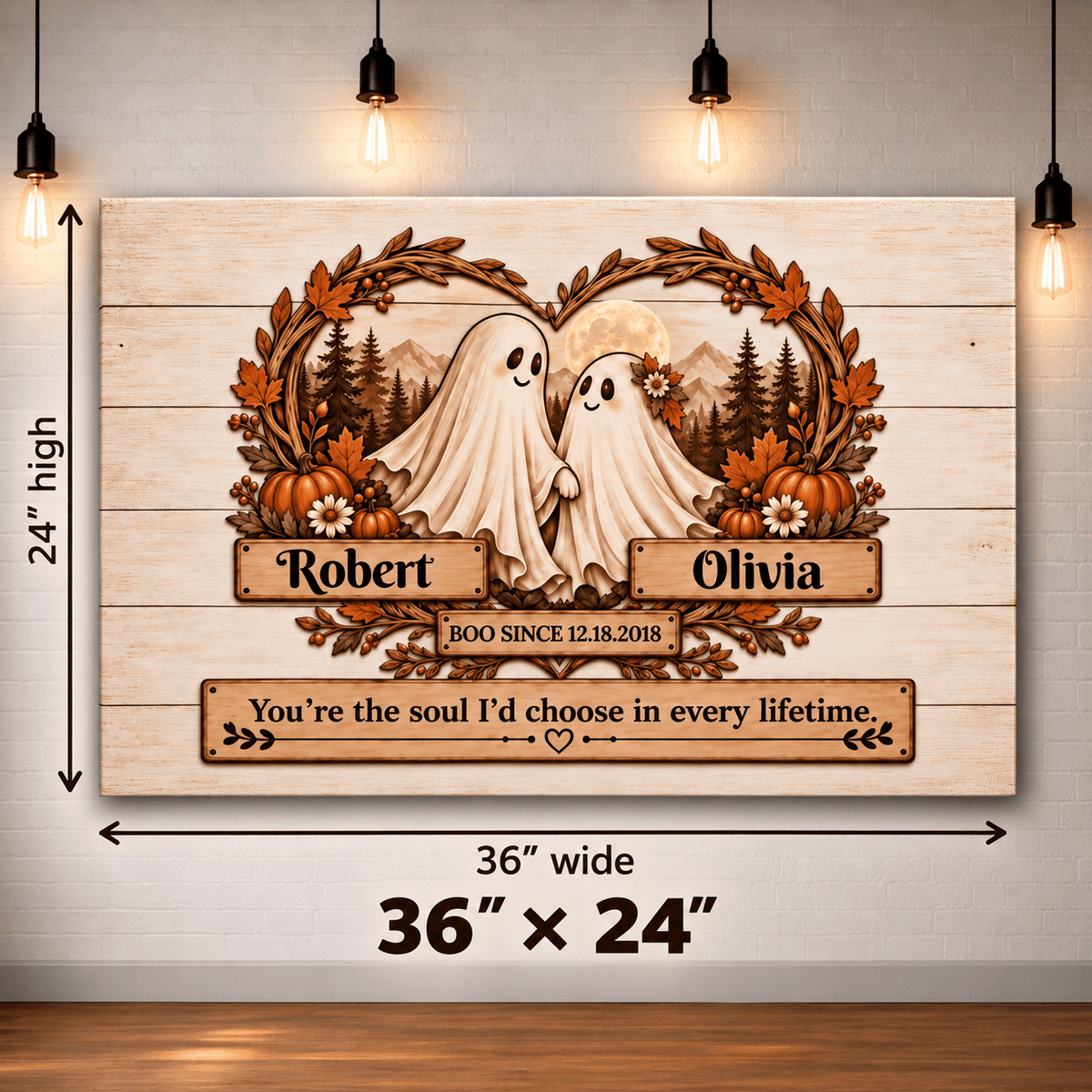 Personalized wooden Halloween wall art featuring two ghost figures framed by autumn leaves, pumpkins, mountains, and a moon, with the names Robert and Olivia and a quote below. The sign is shown hanging against a light wall with hanging bulbs, and dimension arrows indicate 36 inches wide by 24 inches high.