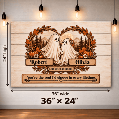 Personalized wooden Halloween wall art featuring two ghost figures framed by autumn leaves, pumpkins, mountains, and a moon, with the names Robert and Olivia and a quote below. The sign is shown hanging against a light wall with hanging bulbs, and dimension arrows indicate 36 inches wide by 24 inches high.